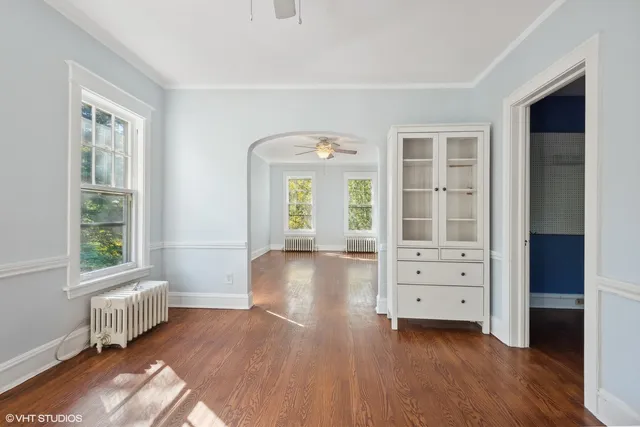 a kitchen with white cabinets and white appliances