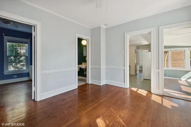 a view of a room with wooden floor and fence