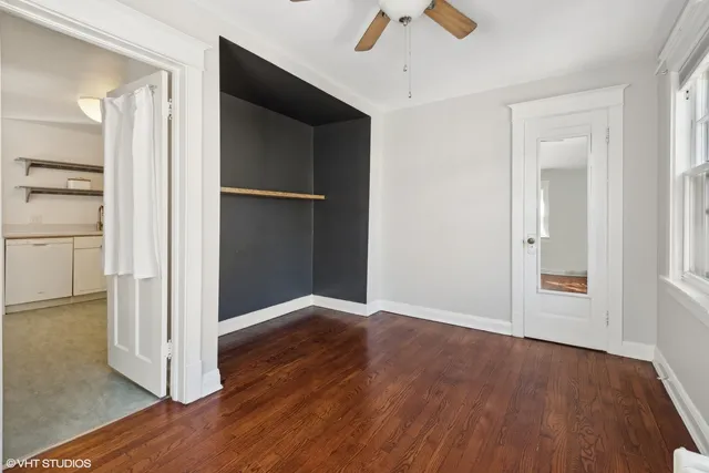 a view of a patio with table and chairs with wooden fence and plants