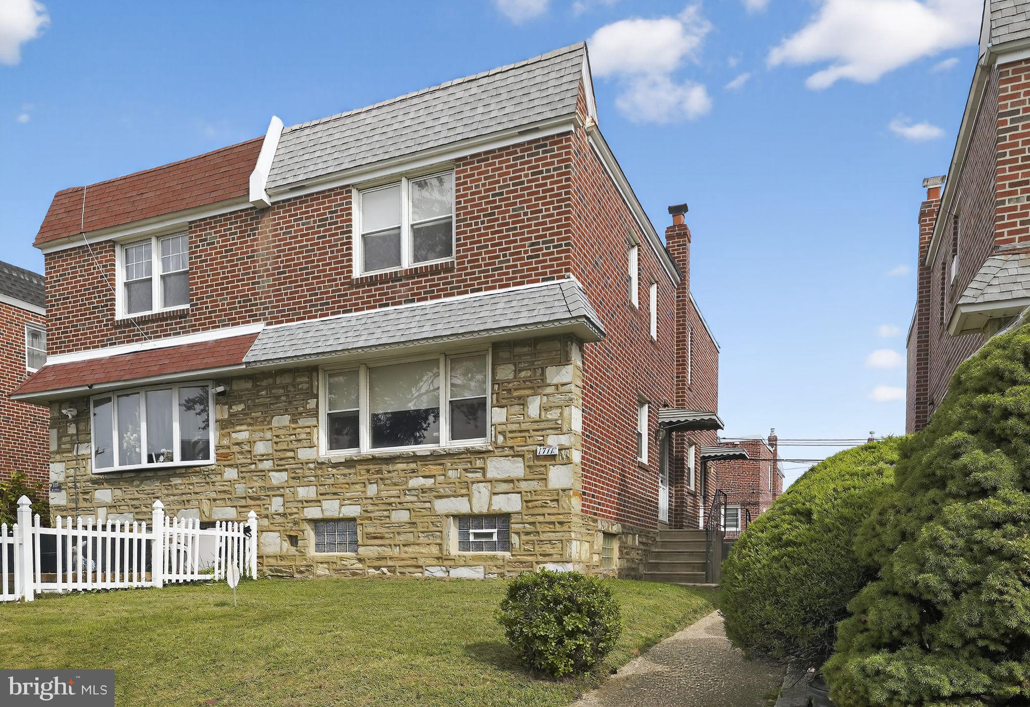 1711 Kendrick Street Philadelphia, PA 19152 - Photo 1 of 29 a front view of a house with a garden
