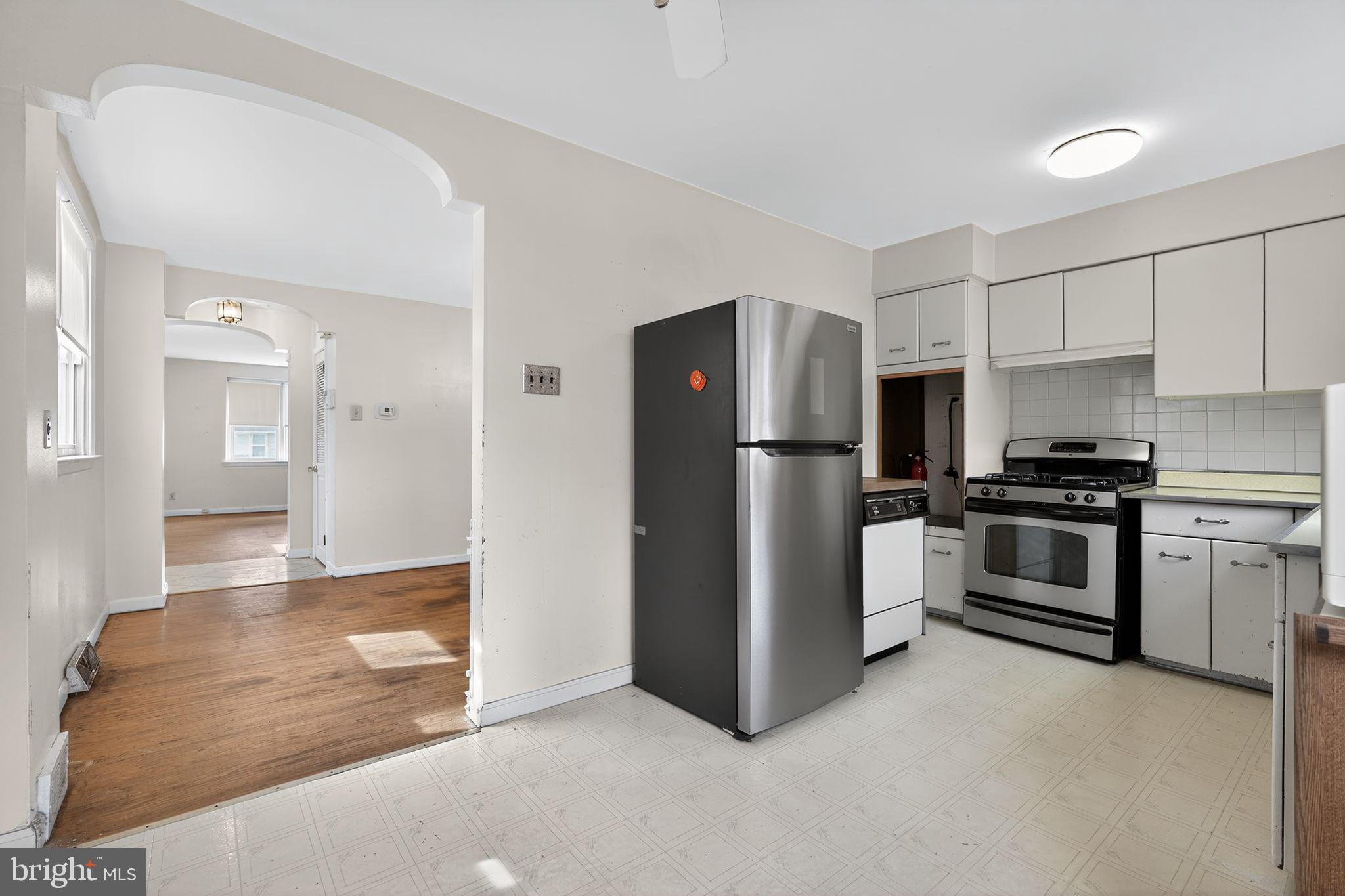 1711 Kendrick Street Philadelphia, PA 19152 - Photo 11 of 29 a kitchen with stainless steel appliances a refrigerator and a stove