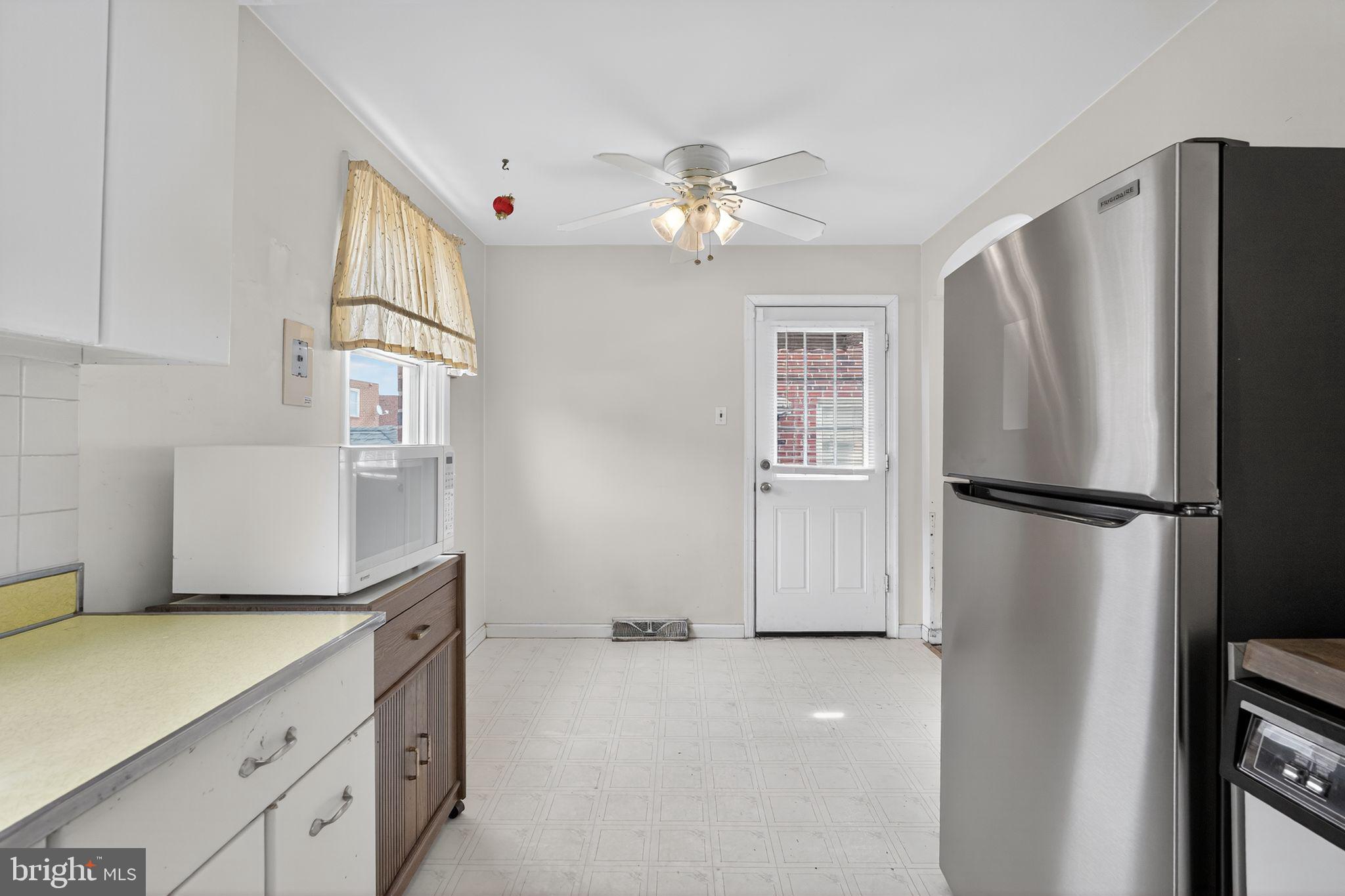 1711 Kendrick Street Philadelphia, PA 19152 - Photo 12 of 29 a kitchen with stainless steel appliances a refrigerator and a cabinets