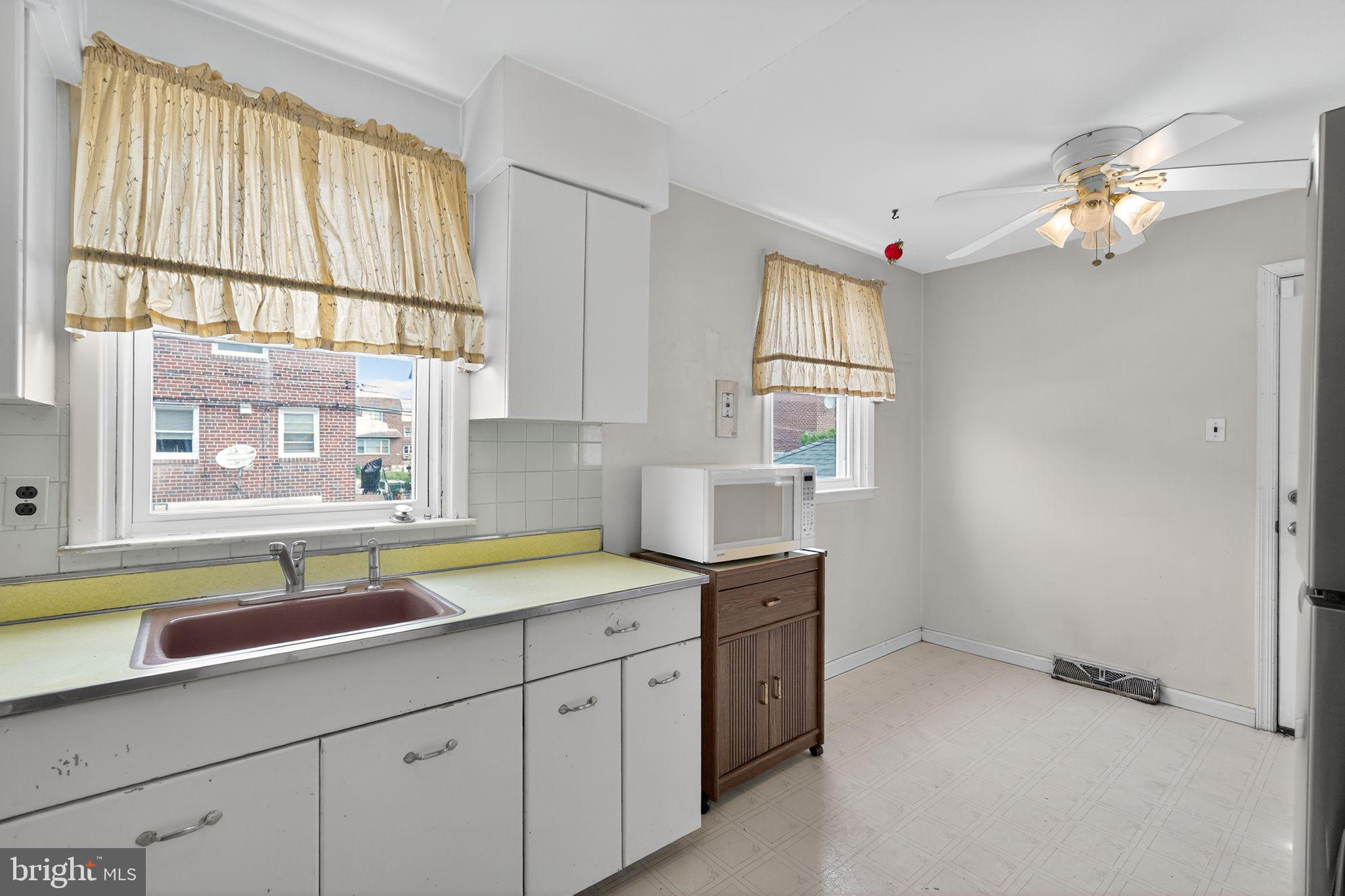 1711 Kendrick Street Philadelphia, PA 19152 - Photo 13 of 29 a kitchen with a sink and a window