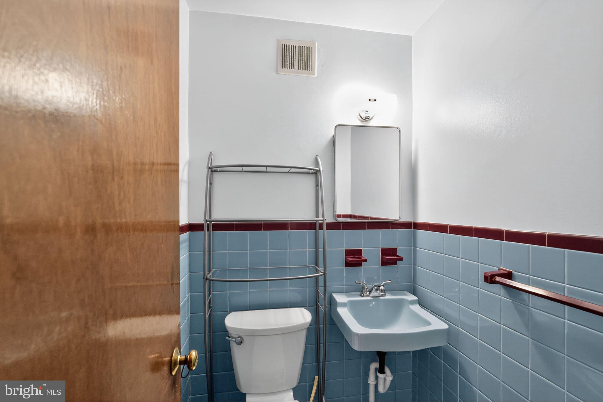 1711 Kendrick Street Philadelphia, PA 19152 - Photo 14 of 29 a bathroom with a sink toilet and mirror