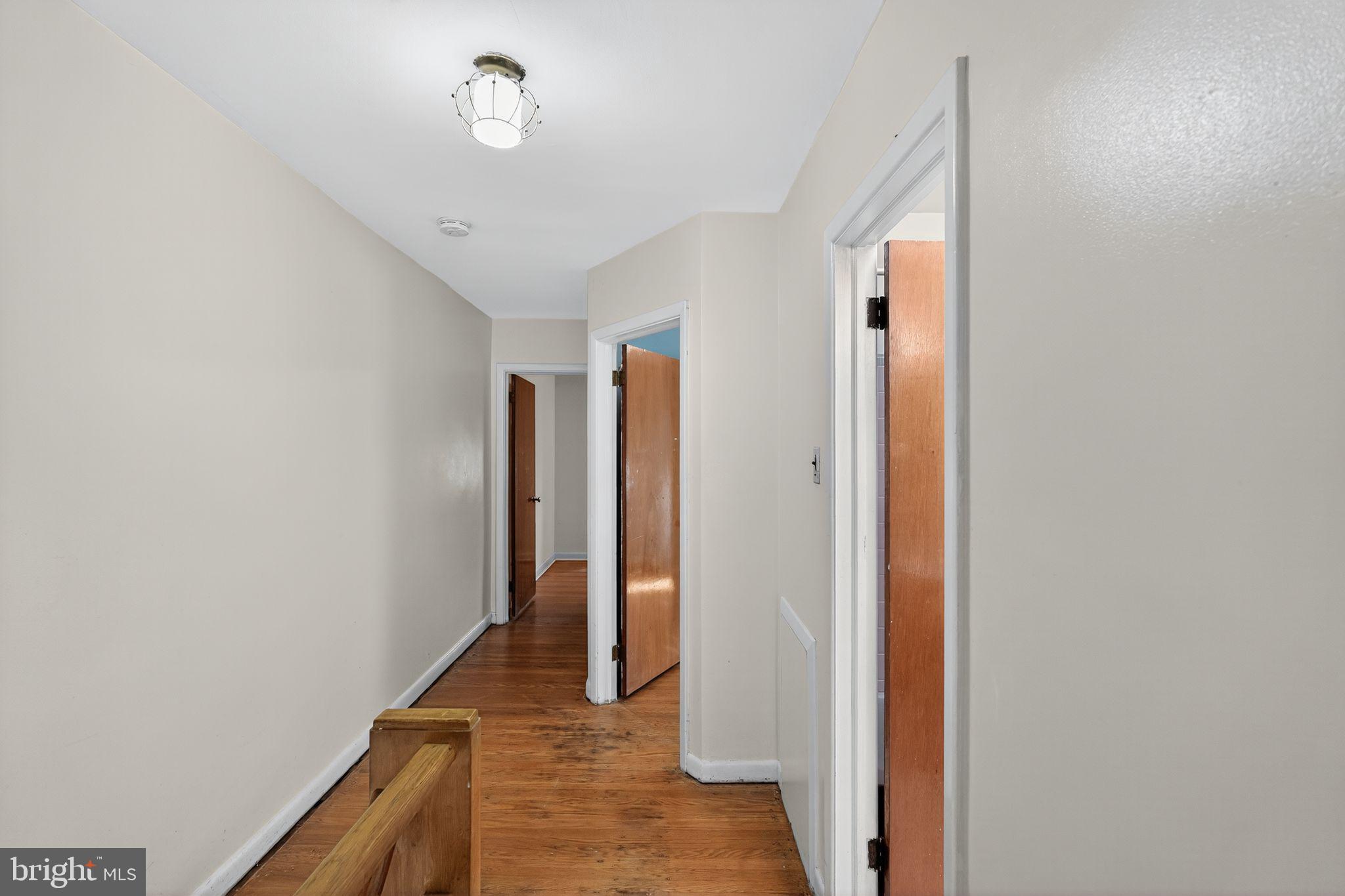 1711 Kendrick Street Philadelphia, PA 19152 - Photo 18 of 29 a view of a hallway with wooden floor and staircase