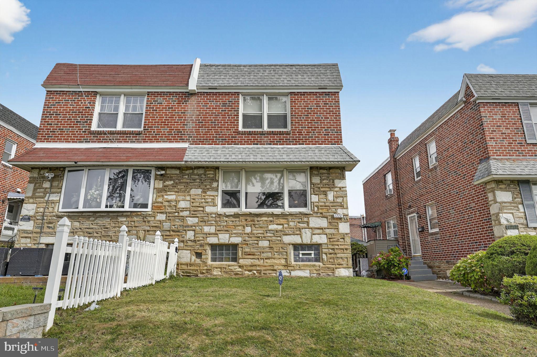 1711 Kendrick Street Philadelphia, PA 19152 - Photo 2 of 29 a view of a brick house with a yard and plants