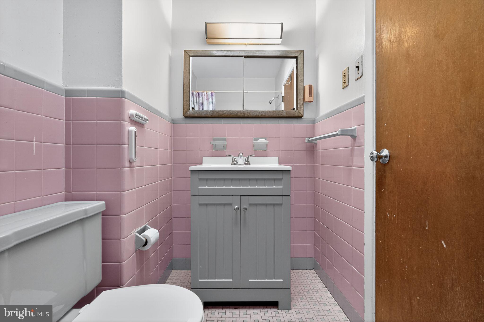 1711 Kendrick Street Philadelphia, PA 19152 - Photo 23 of 29 a bathroom with a sink toilet and mirror
