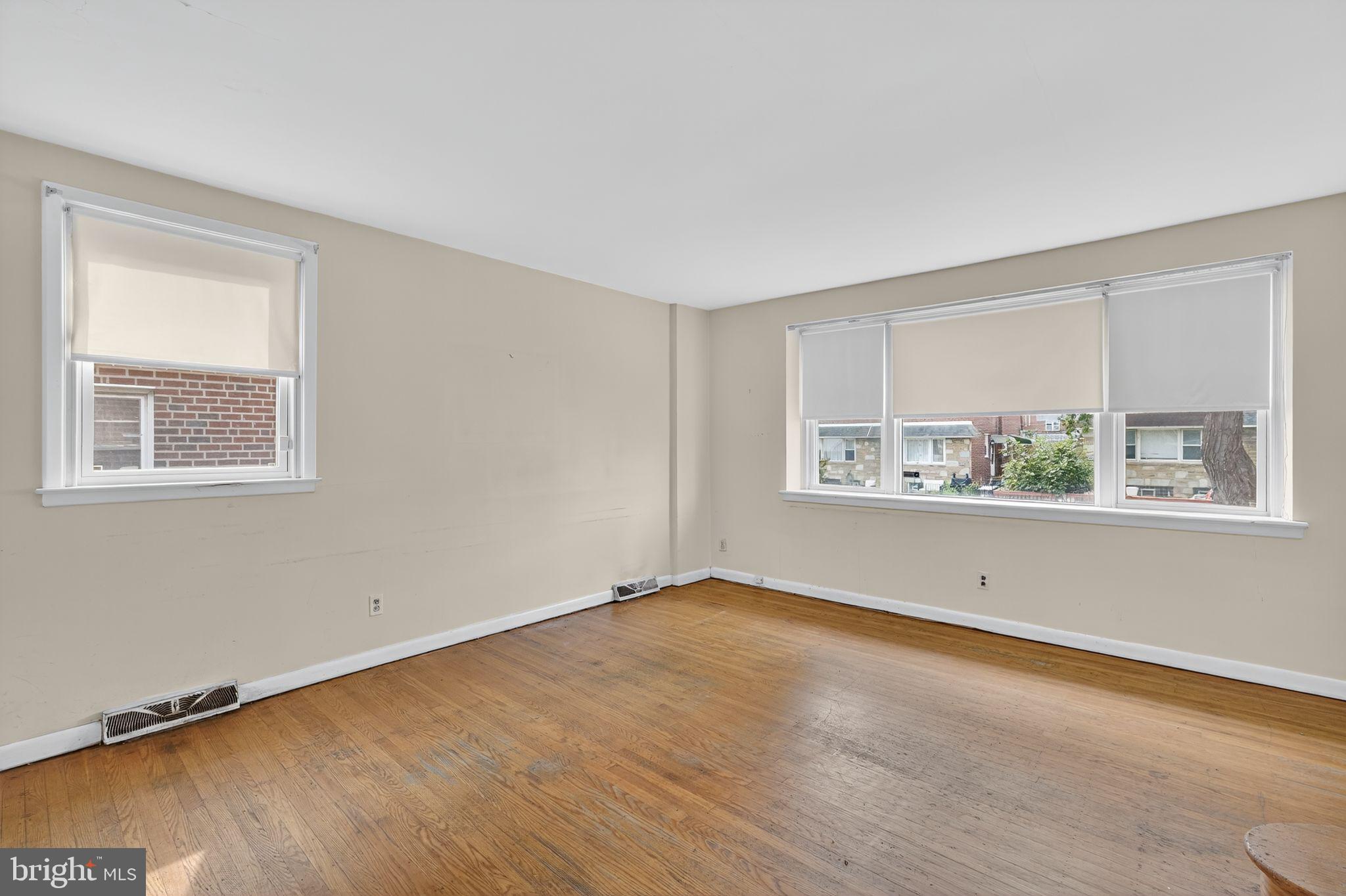 1711 Kendrick Street Philadelphia, PA 19152 - Photo 3 of 29 a view of an empty room with wooden floor and a window