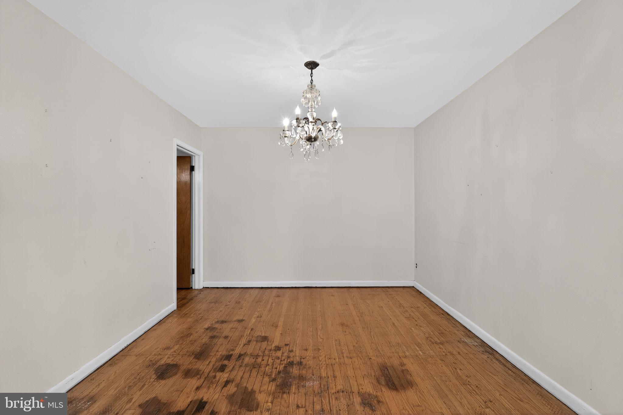 1711 Kendrick Street Philadelphia, PA 19152 - Photo 7 of 29 a view of a room with wooden floor and a chandelier