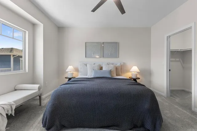 a bedroom with bed and window