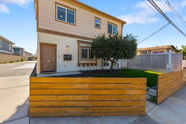 a view of a house with a back yard
