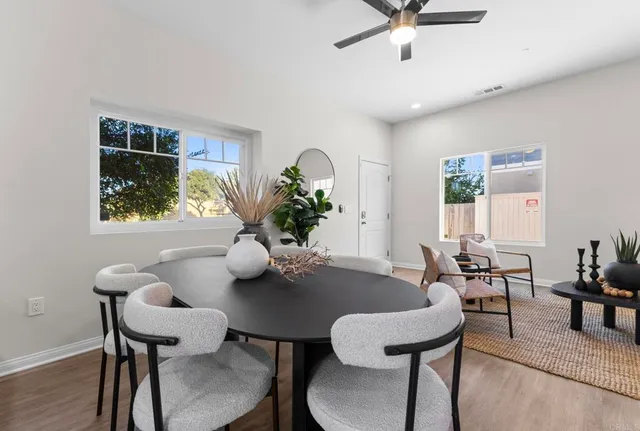 a dining room with furniture and window