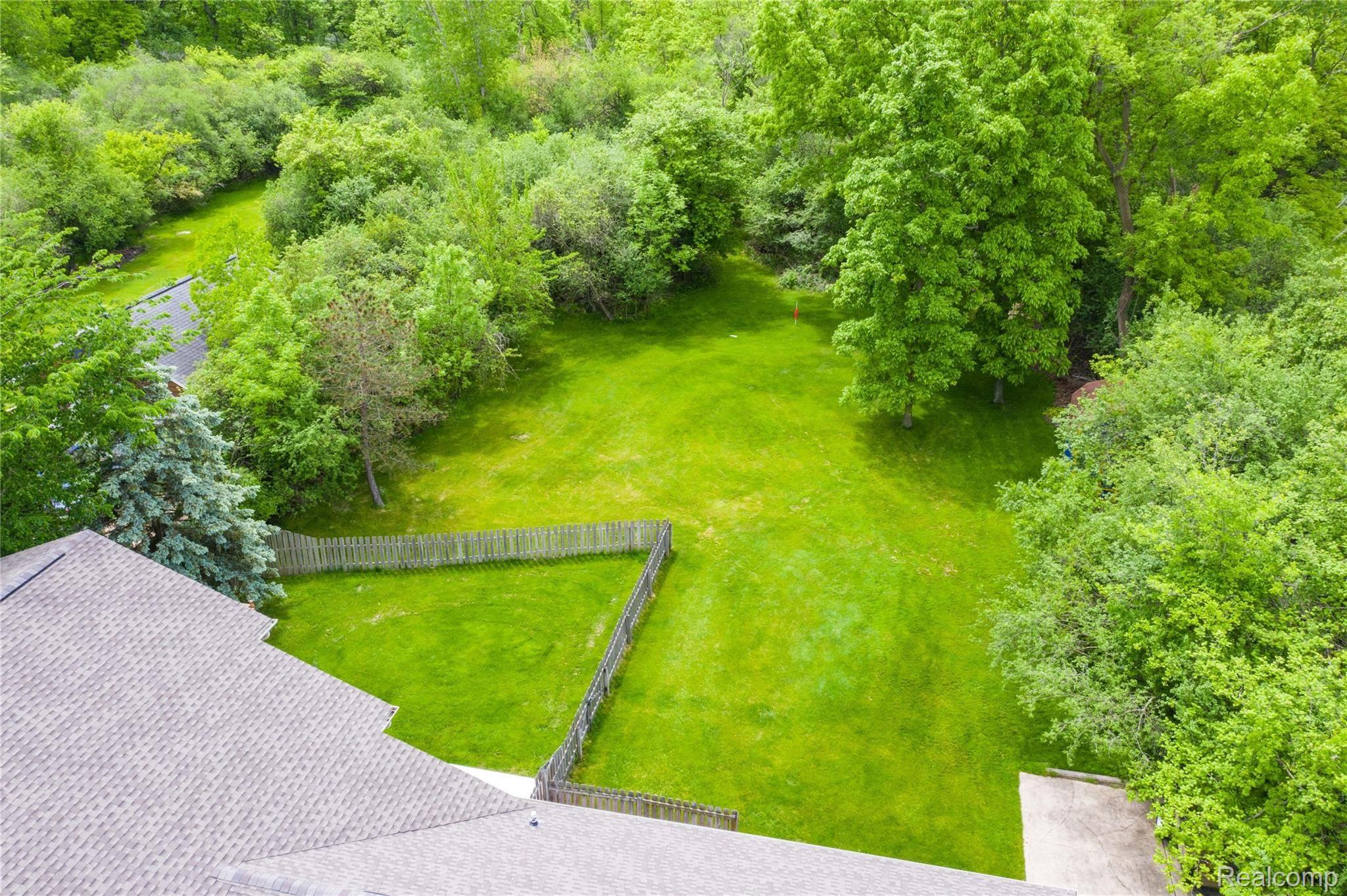 8443 Bridge Road Grosse Ile, MI 48138 - Photo 7 of 33 Beautiful yard setting with woods. 1.25 acre.
