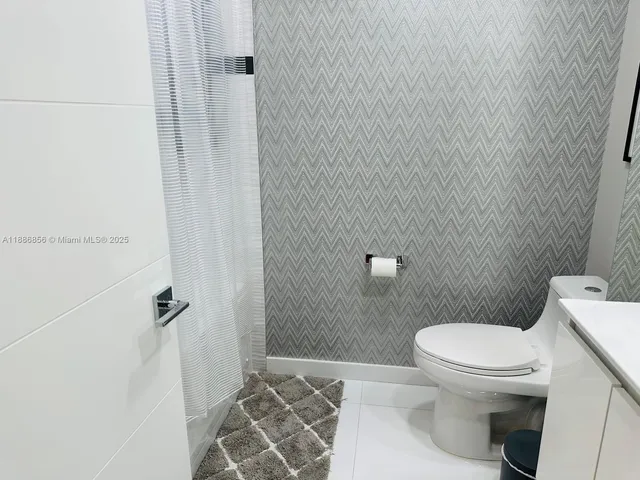 a bathroom with a toilet and a sink