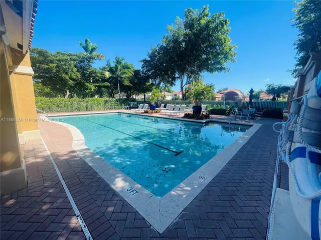 a view of a swimming pool with a lounge chairs
