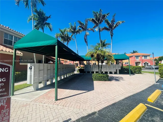 a view of a swimming pool with a table and chairs