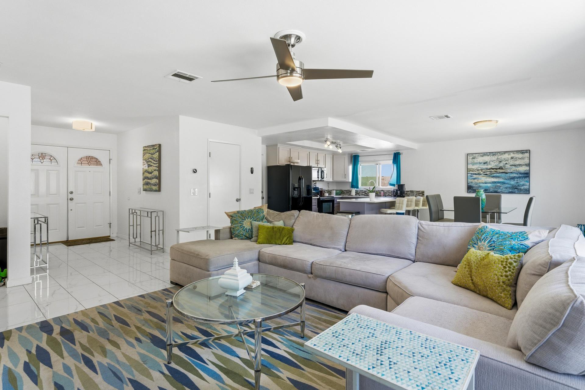 67220 Quijo Road Cathedral City, CA 92234 - Photo 6 of 26 a living room with furniture and kitchen view
