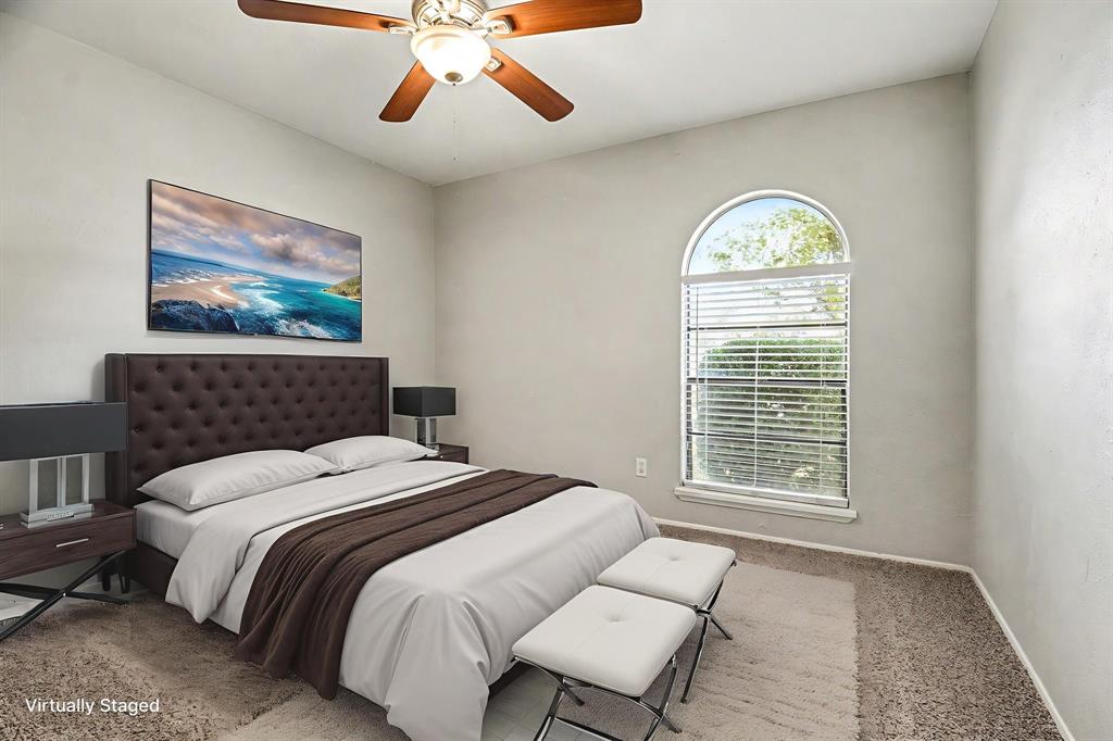 6532 Blue Ridge Trail Plano, TX 75023 - Photo 17 of 25 a bedroom with a bed and a window