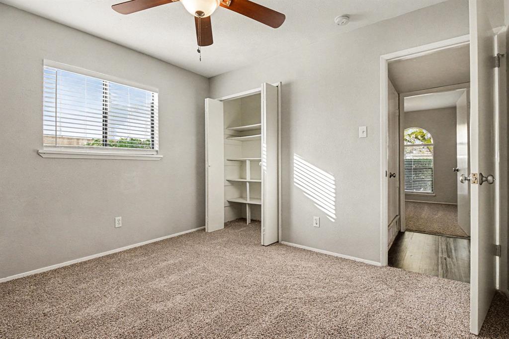 6532 Blue Ridge Trail Plano, TX 75023 - Photo 18 of 25 wooden floor and windows in an empty room