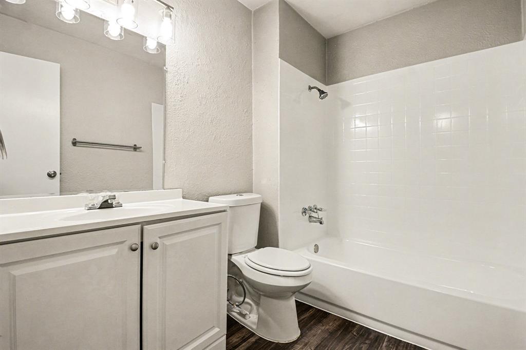 6532 Blue Ridge Trail Plano, TX 75023 - Photo 19 of 25 a bathroom with a sink toilet and shower