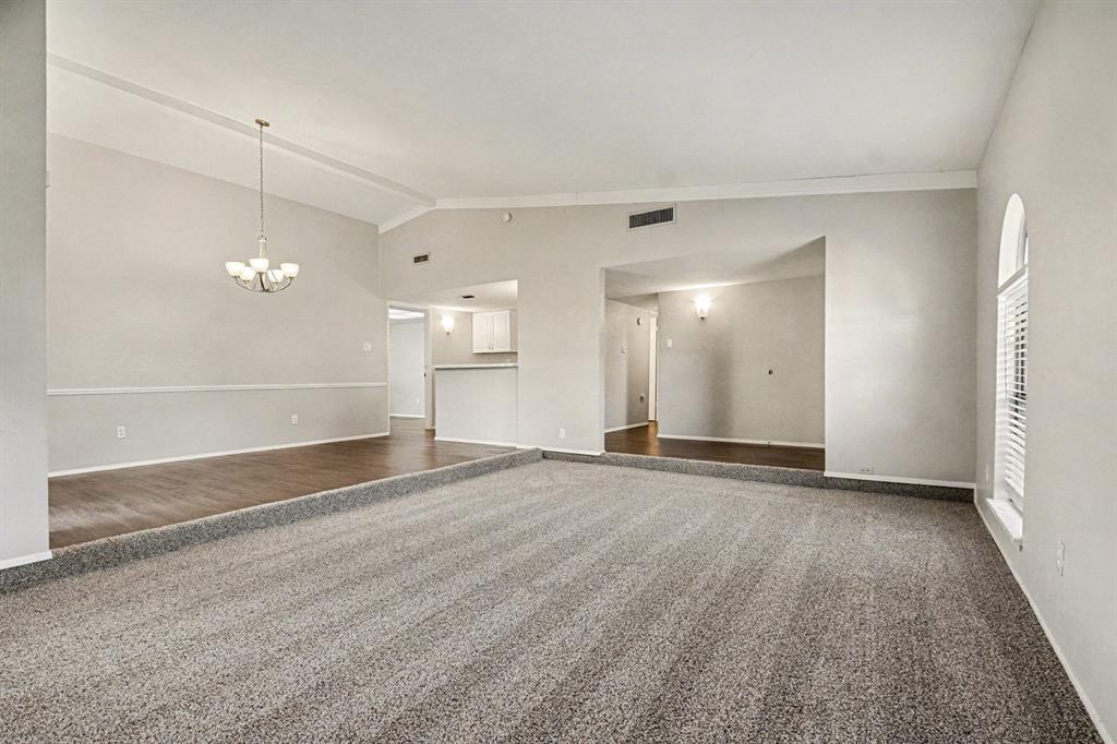 6532 Blue Ridge Trail Plano, TX 75023 - Photo 5 of 25 wooden floor in an empty room with a window