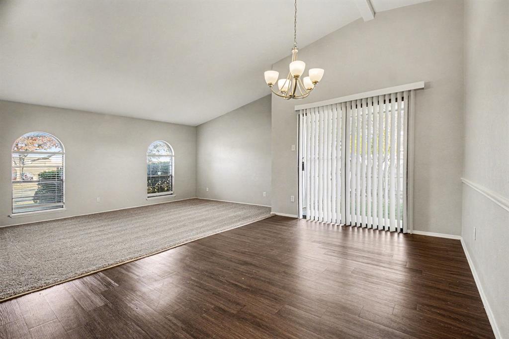 6532 Blue Ridge Trail Plano, TX 75023 - Photo 6 of 25 an empty room with wooden floor and windows