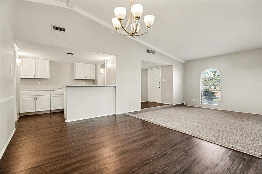 6532 Blue Ridge Trail Plano, TX 75023 - Photo 7 of 25 a view of a kitchen with wooden floor and a sink