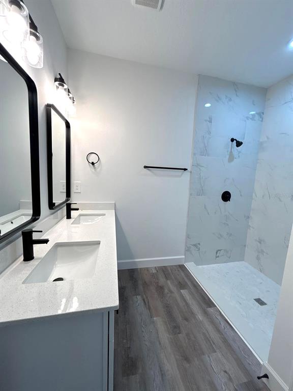 1683 Southwest 3rd Street Ocala, FL 34471 - Photo 10 of 14 a bathroom with a tub sink and mirror