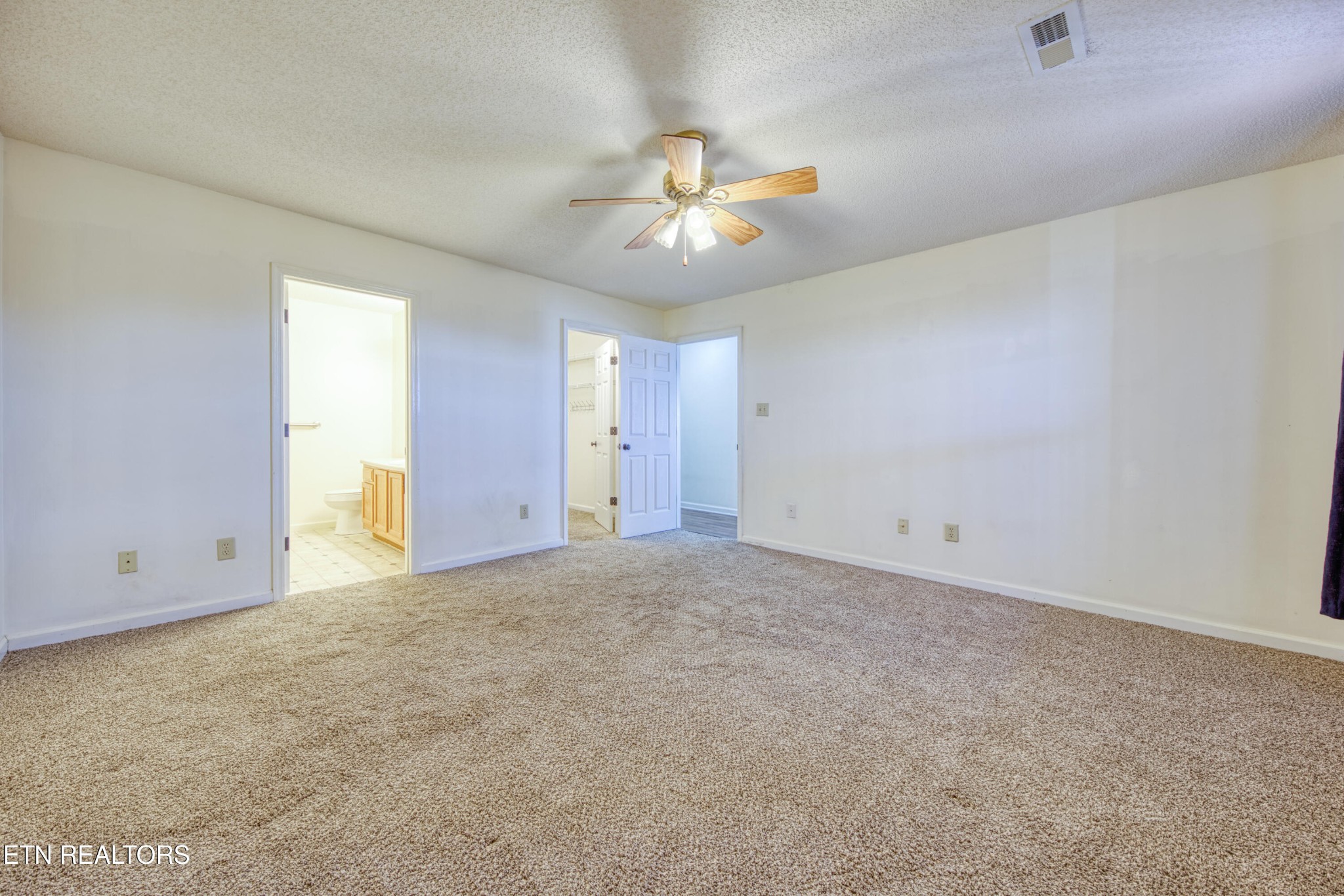 8024 Keybridge Way Powell, TN 37849 - Photo 16 of 23 an empty room with windows and fan