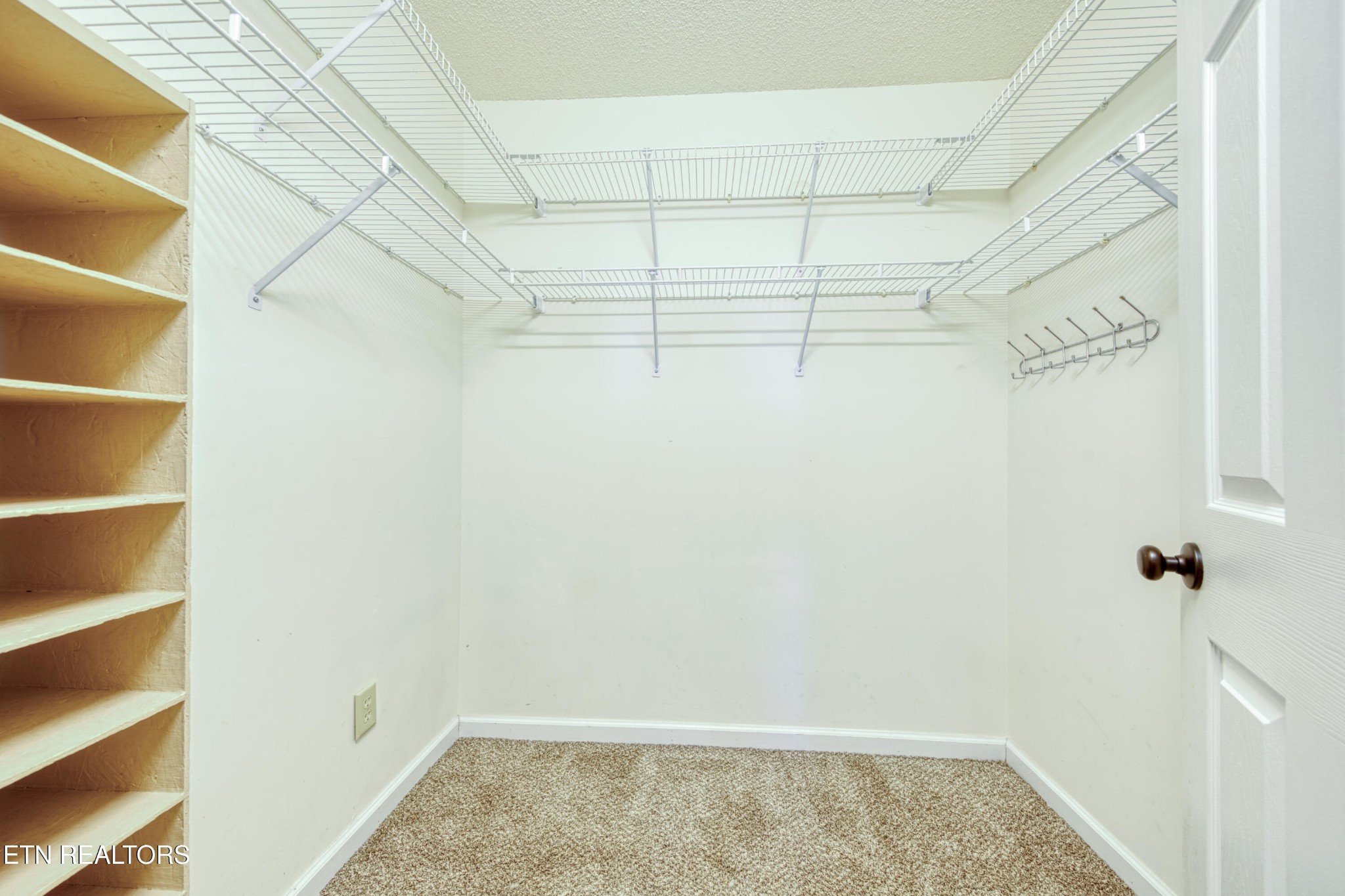 8024 Keybridge Way Powell, TN 37849 - Photo 19 of 23 a view of a room with racks on the wall