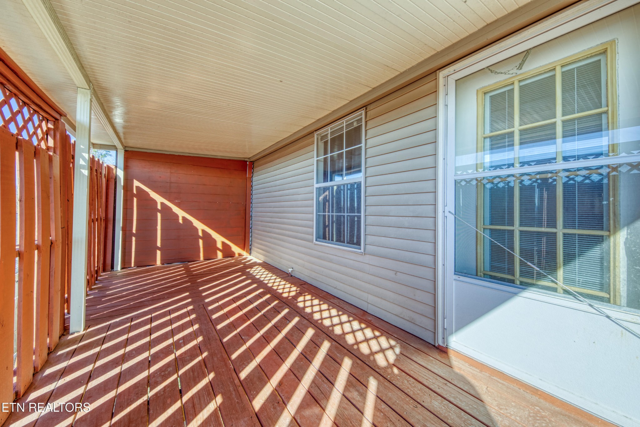 8024 Keybridge Way Powell, TN 37849 - Photo 20 of 23 a view of a balcony with wooden floor and fence and a window