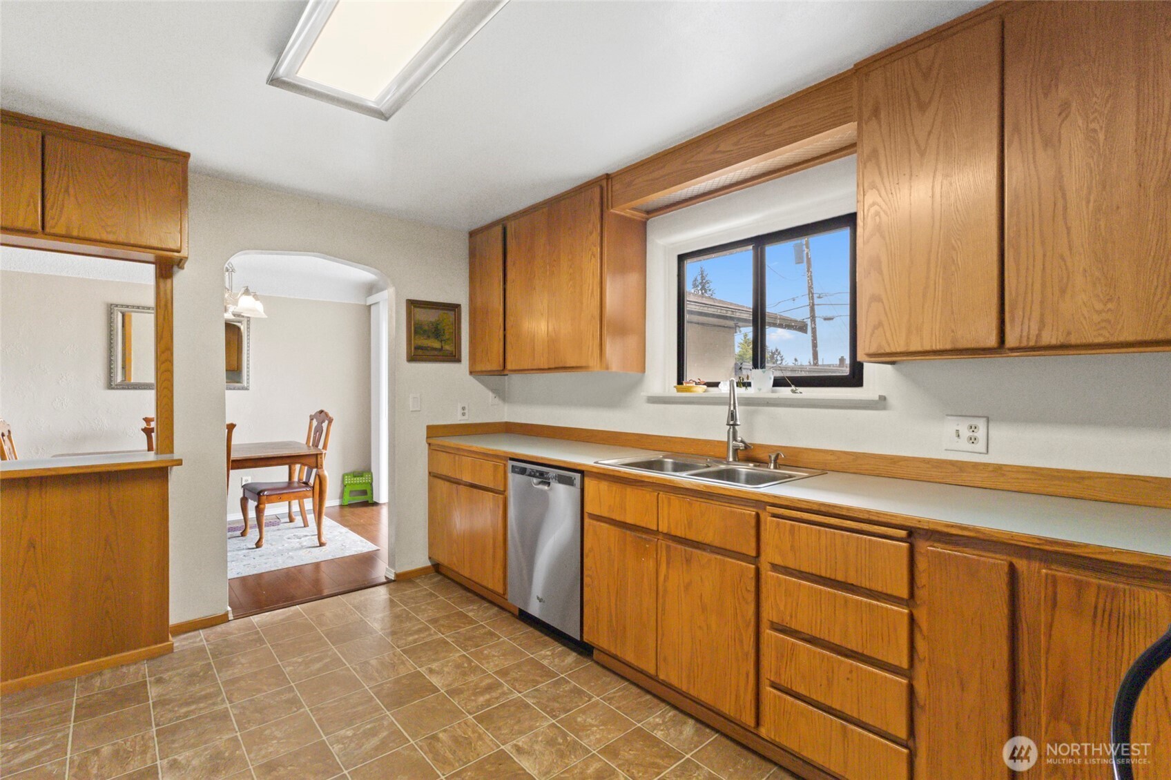 5117 Delaware Avenue Everett, WA 98203 - Photo 12 of 36 a kitchen with stainless steel appliances granite countertop a sink and cabinets
