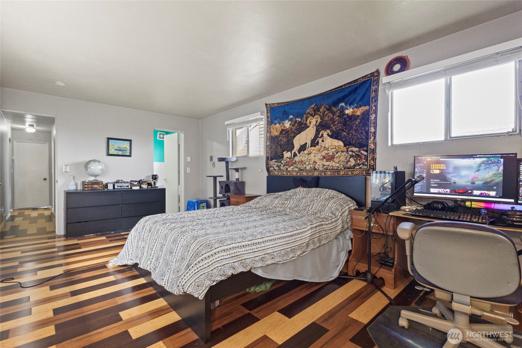 5117 Delaware Avenue Everett, WA 98203 - Photo 17 of 36 a bedroom with a bed and dresser with mirror