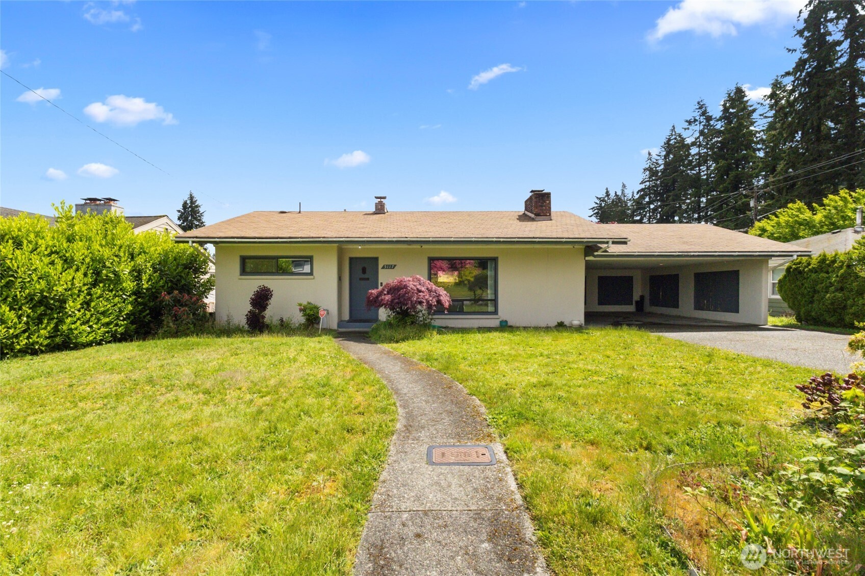 5117 Delaware Avenue Everett, WA 98203 - Photo 2 of 36 a front view of a house with swimming pool