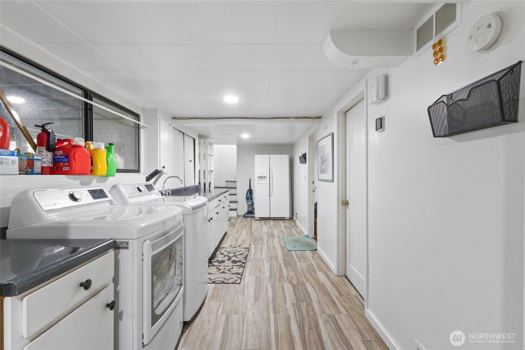 5117 Delaware Avenue Everett, WA 98203 - Photo 26 of 36 a kitchen with stainless steel appliances granite countertop a lot of counter space and wooden floors