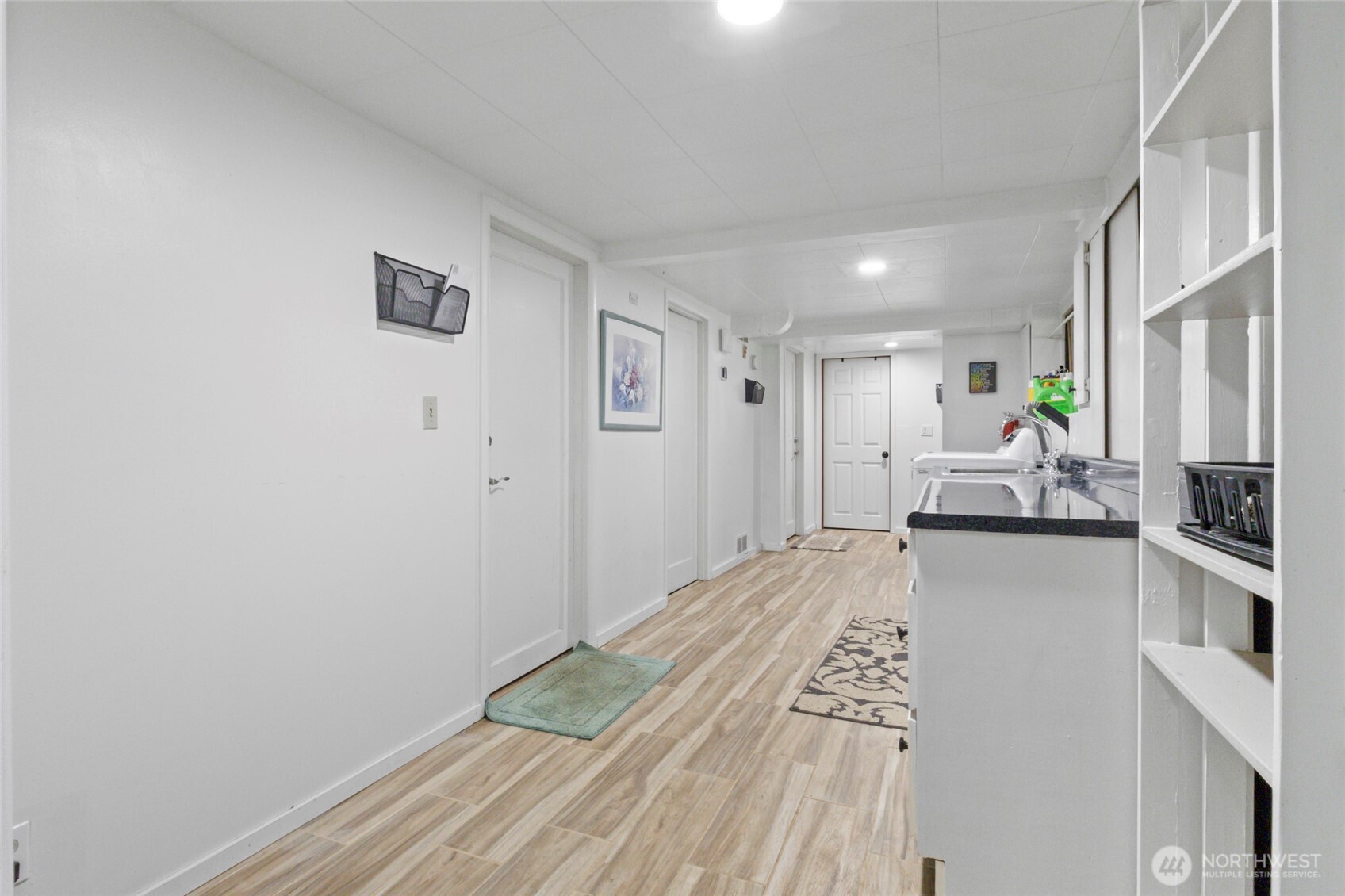 5117 Delaware Avenue Everett, WA 98203 - Photo 29 of 36 a view of a kitchen with kitchen island wooden floor center island and stainless steel appliances