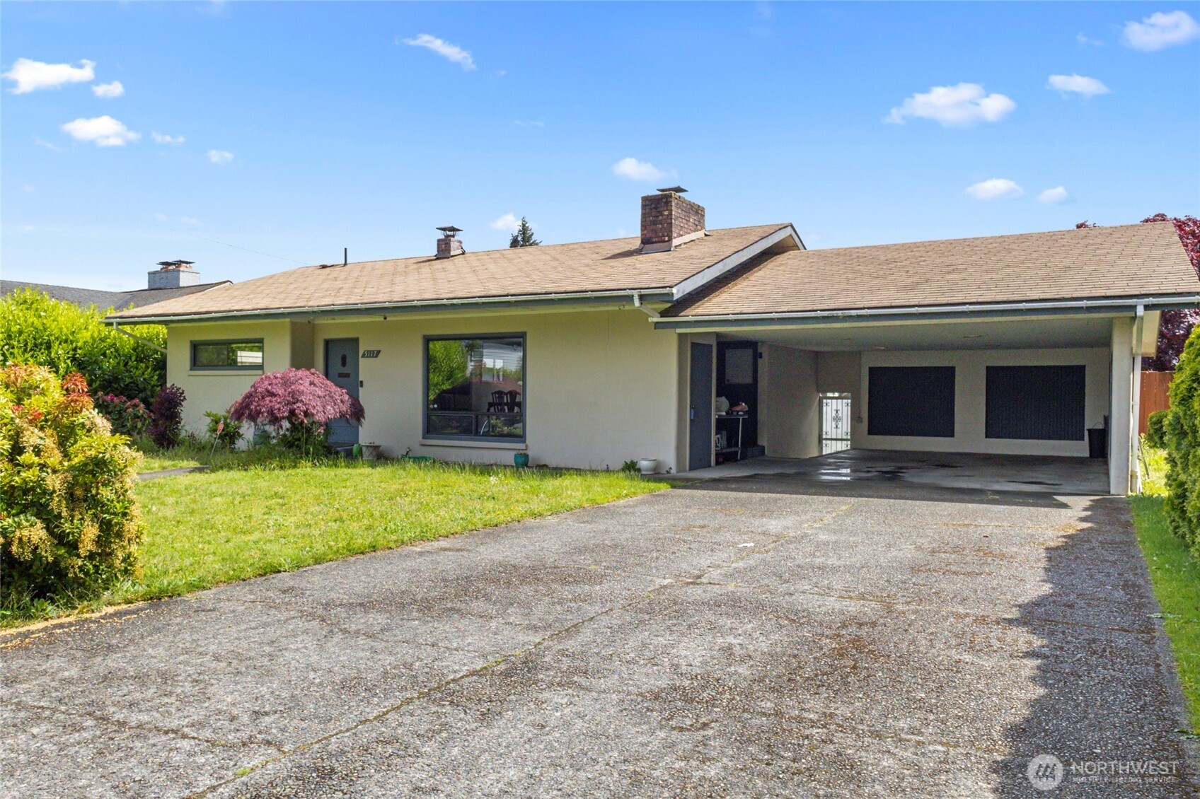 5117 Delaware Avenue Everett, WA 98203 - Photo 3 of 36 a front view of a house with garden