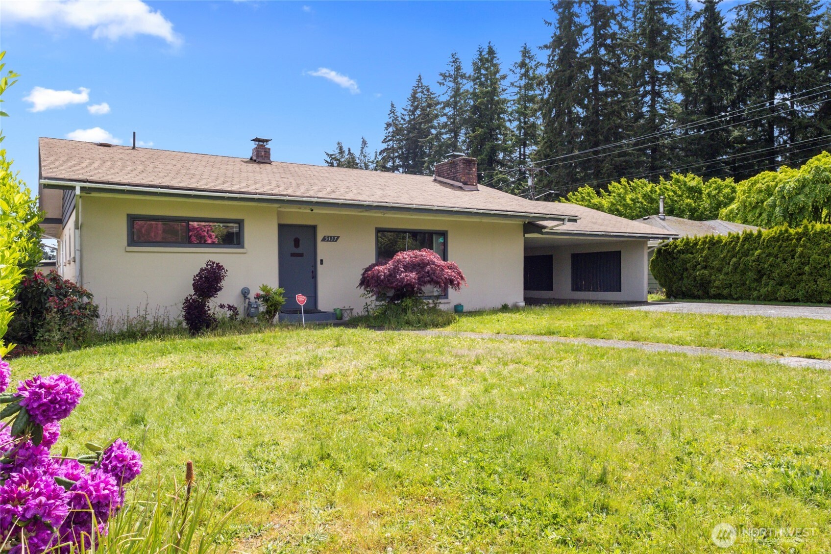 5117 Delaware Avenue Everett, WA 98203 - Photo 4 of 36 a view of a house with backyard and garden