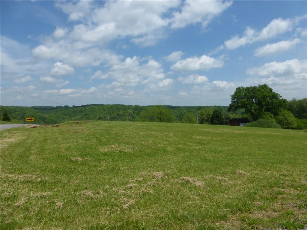 242 Reibold Road Renfrew, PA 16053 - Photo 3 of 14 a view of a green field with wooden fence