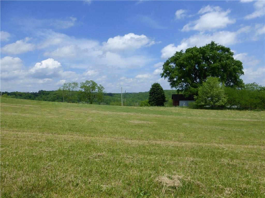 242 Reibold Road Renfrew, PA 16053 - Photo 6 of 14 a view of a field with an buildings in the background