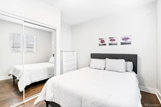 a bedroom with two beds and a window