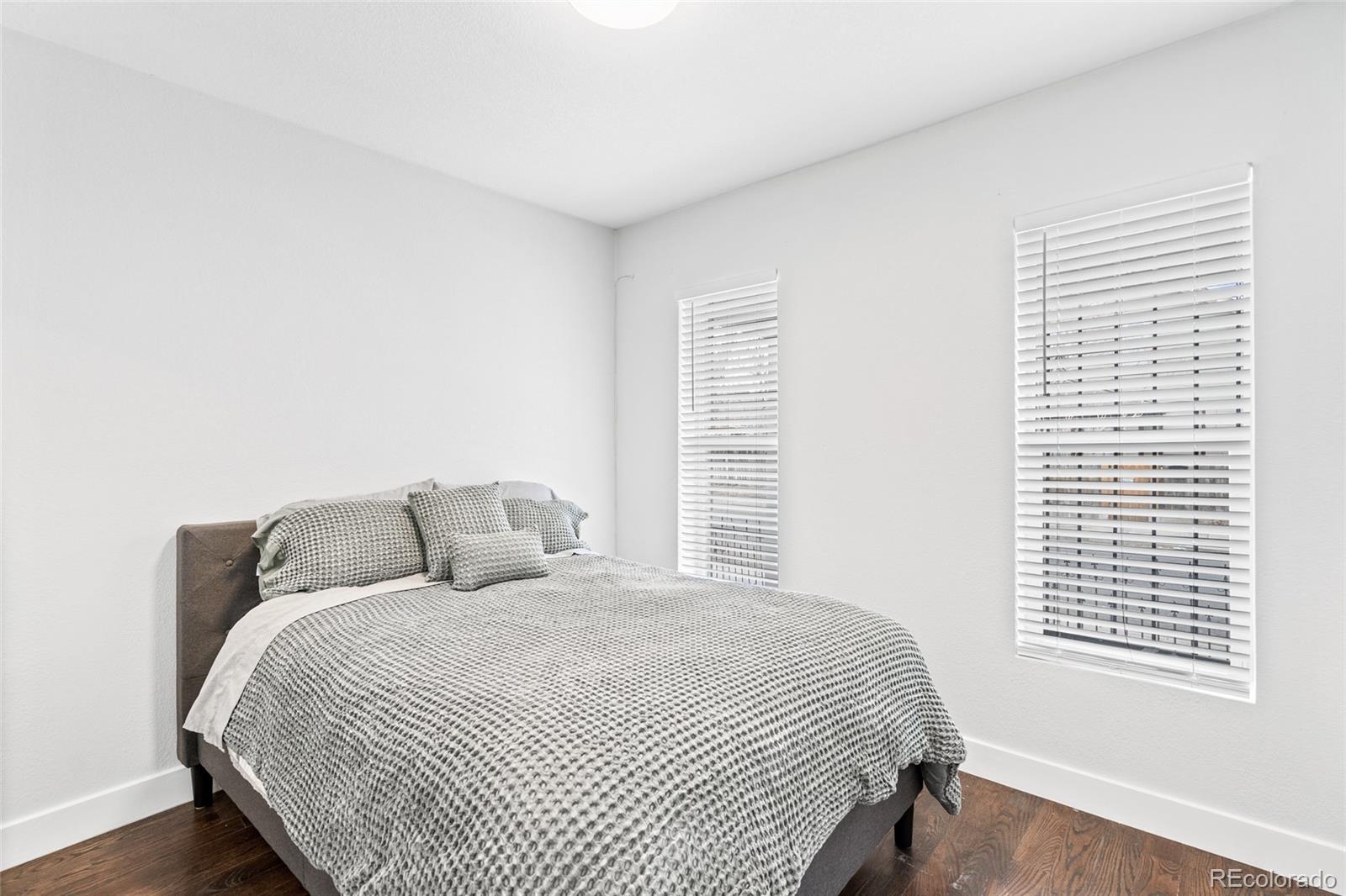 Undisclosed Address Denver, CO 80216 - Photo 21 of 25 a bedroom with a bed and a window