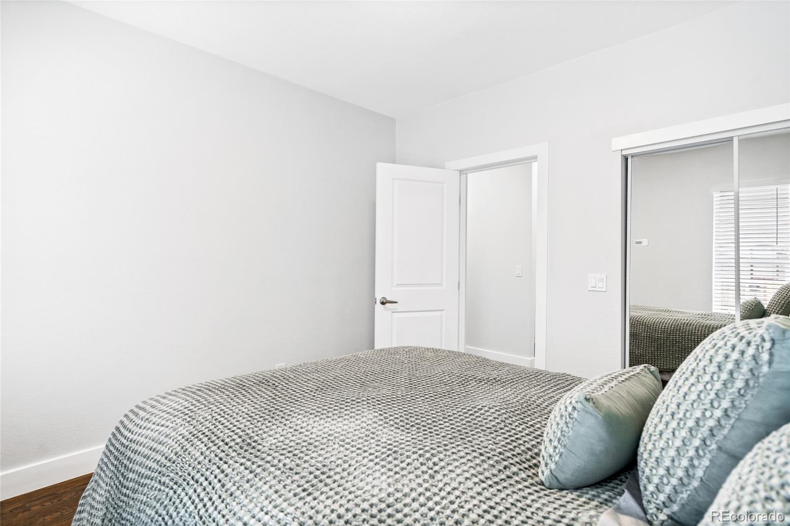 Undisclosed Address Denver, CO 80216 - Photo 23 of 25 a bedroom with a bed and a window