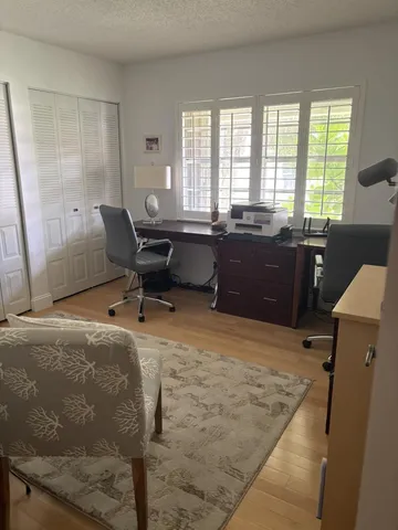 a workspace with furniture and a window