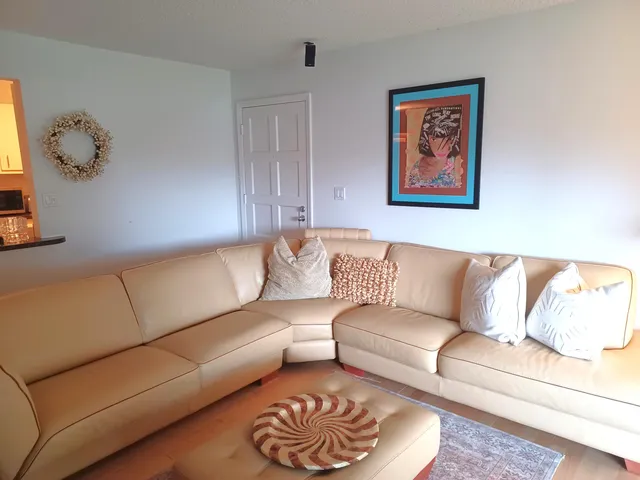 a living room with furniture and a couch