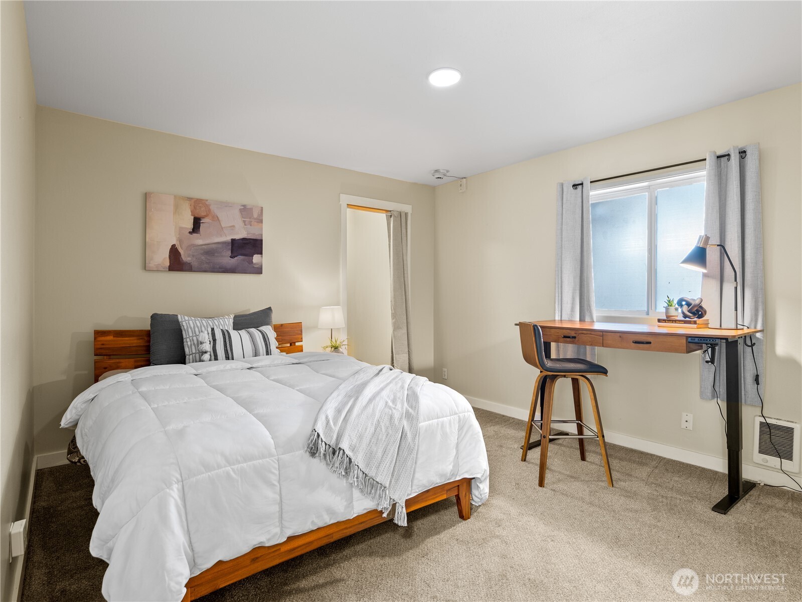 465 Winslow Way East, Unit 108 Bainbridge Island, WA 98110 - Photo 16 of 38 a bedroom with a bed and a table