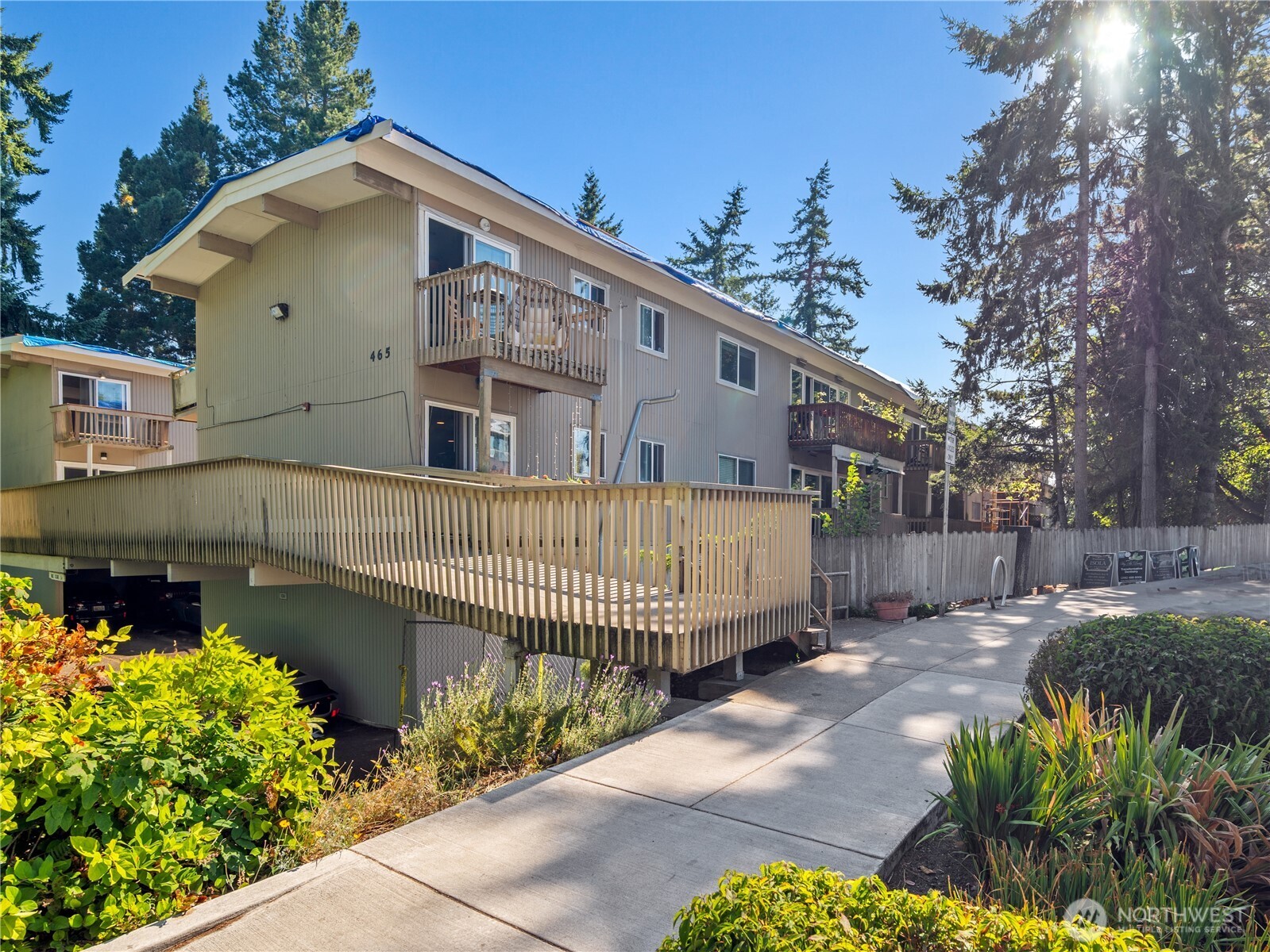 465 Winslow Way East, Unit 108 Bainbridge Island, WA 98110 - Photo 32 of 38 a front view of a house with a yard
