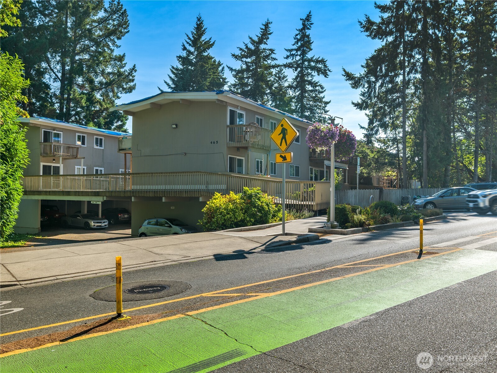 465 Winslow Way East, Unit 108 Bainbridge Island, WA 98110 - Photo 34 of 38 a front view of a house with a yard and garage
