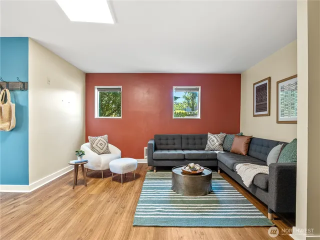 a living room with furniture and a rug