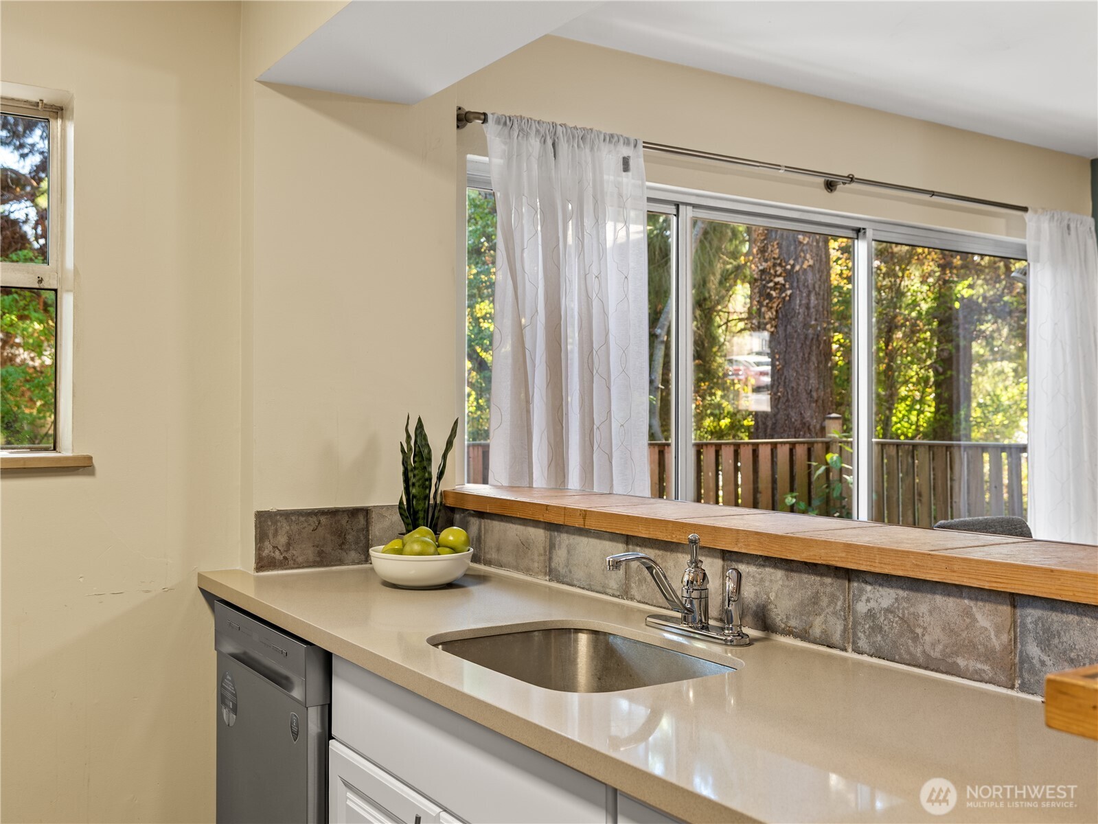 465 Winslow Way East, Unit 108 Bainbridge Island, WA 98110 - Photo 9 of 38 a kitchen with a sink and a window